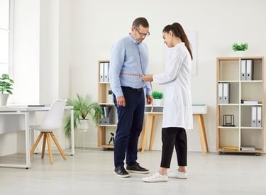 a doctor examining a patient's waist with a measuring tape measure tape