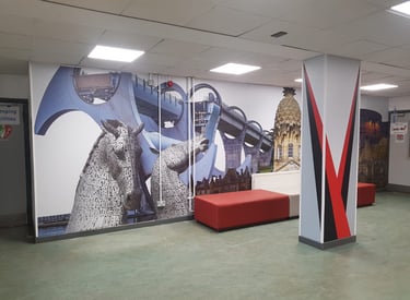 a large wall mural of a large mural of a woman in a red dress