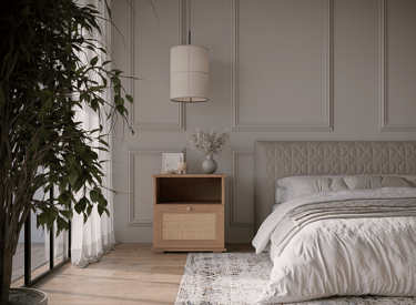 a bedroom with a bed and a plant in the middle of the room