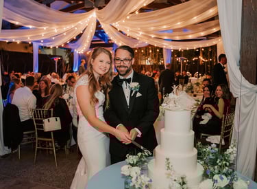 Bride and groom cutting cake at Bali Hai Restaurant wedding 