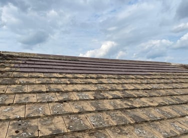 Damaged roof being repaired by experienced contractors