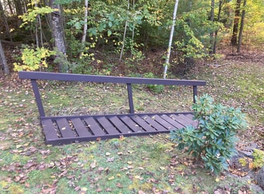 a bench with a bench and a bench in the grass