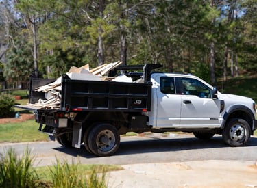 2024 Ford F-550 high side dump truck parked in a clean suburban driveway in Fredericksburg, Virginia