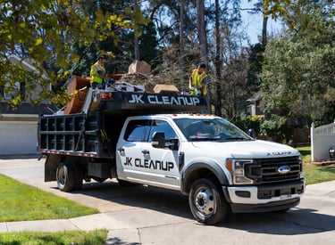 Junk removal in action — Ford F-550 dump truck being loaded in Fredericksburg, Stafford, and Spotsyl