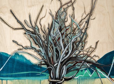 a bundle of twigs against a mountain background