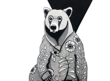 a bear in pjs with a black and white background