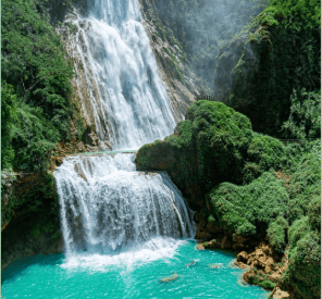 a waterfall in the middle of a mountain in Mexico wellness retreat