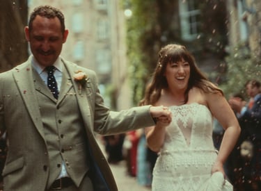 a man and woman walking down a street