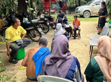 Environmental data collection through interview with Orang Asli community in Malaysian forest.