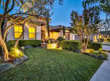 Front image of home at night all lit up