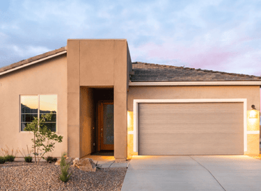 a house with a garage door and a driveway