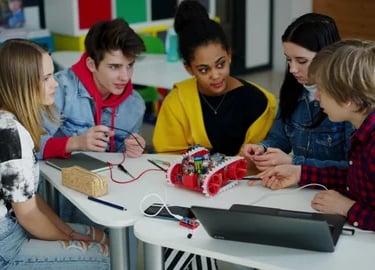 Middle school students discussing robotics