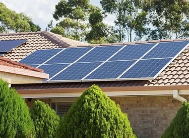 Residential solar panels installed on a tiled rooftop for renewable energy and lower utility bills.