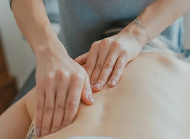 hand massaging woman's body