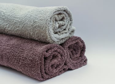 Three different towels rolled together for better display