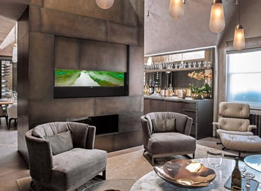 Large TV hidden behind a moving wall panel
