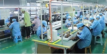 a group of people working on a factory floor CCTV
