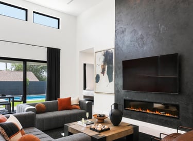Modern Roman clay fireplace with a smooth, textured finish, creating a warm and sophisticated focal