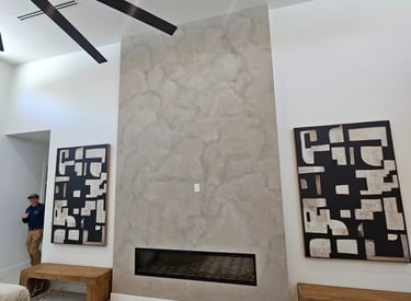 A hand-applied natural limewash finish softens the texture of this fireplace