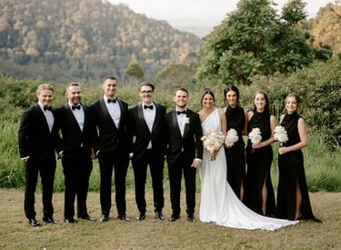 Wedding party at venue standing for photographer
