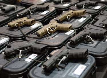 guns on display at gun show booth