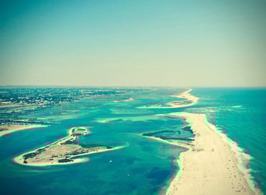 a view of a beach with a sandy beach and a sandy beach