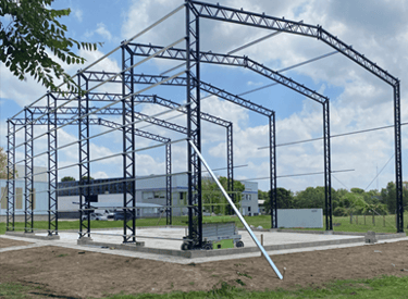 Steel structure of an industrial building under construction, structural engineering project