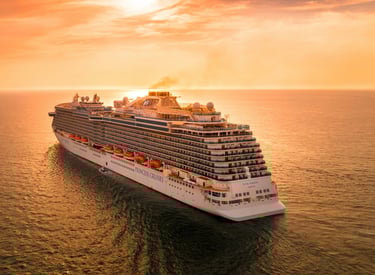 Cruise ship sailing at sunset