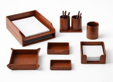 Matching leather desk accessories set including trays and holders for organized workspaces.