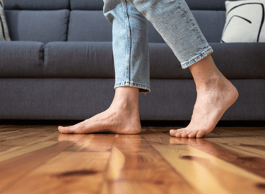 Healthy feet walking on wood floors. Clean and solid wood floors.
