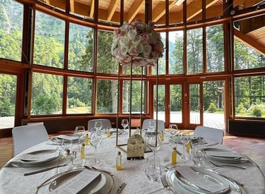 A wedding table set with flowers in the middle