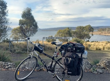 a bikepacking bicycle at a rest stop next to a Tasmanian beach
