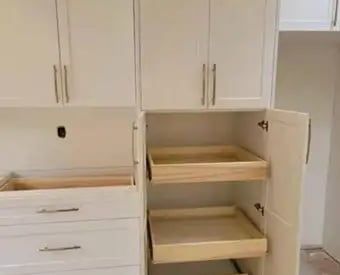 a kitchen with a pantry from kitchenrta with white cabinets and drawers