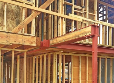 Structural steel framing in residential remodel by SAE Builders.