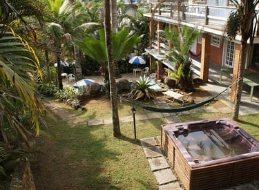 a hot tub in a tropical setting