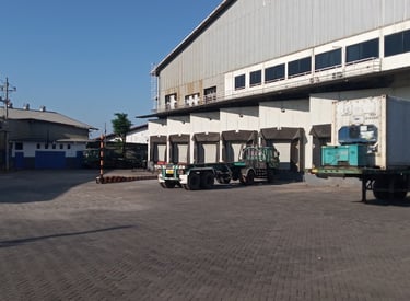 a truck parked in front of a building cold storage