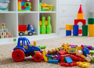a toy truck with a toy tractor and toys