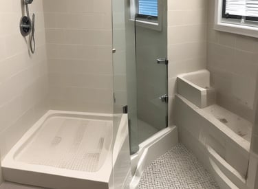 white wooden kitchen island and cupboard cabinets near glass panel door