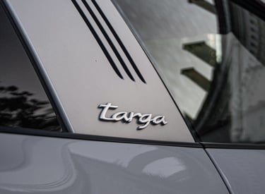 an Enlab Porsche car with a targa tag on the side of it