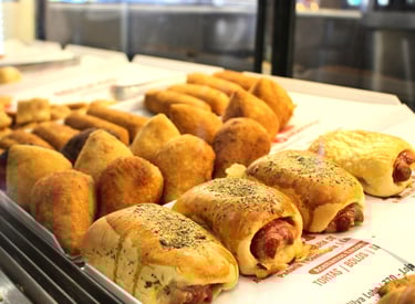 a tray of food that includes sausages and sausages