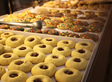 a tray of cookies and doughnuts on display