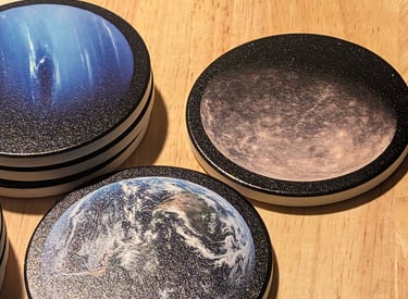 Set of custom coasters featuring planets.