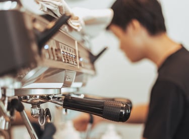 photo of a espresso machine in a coffee shop