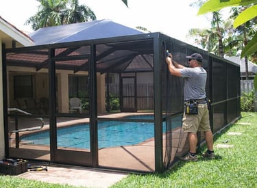 Pool screen enclosure being repaired