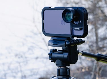 Mobile filmaking gear with an iPhone, a gimbal, and clip on lense