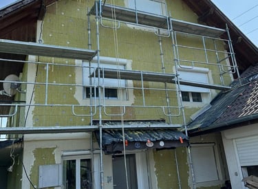 a house with a scafaffe on a scaffolded up to