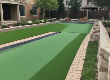 A friendly team member installing pavers in a sunny backyard with lush green turf nearby.