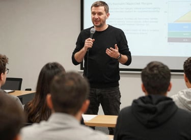 Speaker Serhiy Boyko passionately explaining management strategies to a small group.