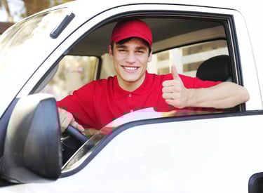 locksmith thumbs up from a truck