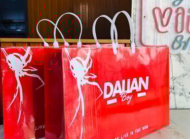 Close-up of vibrant custom paper bags with sleek logos in a modern office setting.